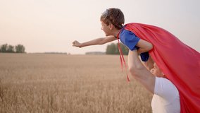 Father man son boy super hero superman. Parent dad having fun to play with little kid child son in happy family lifestyle together summer day wheat field sunset Concept win success winner hero victory - Powered by Shutterstock - Get 15% off with code: PIKWIZARD15