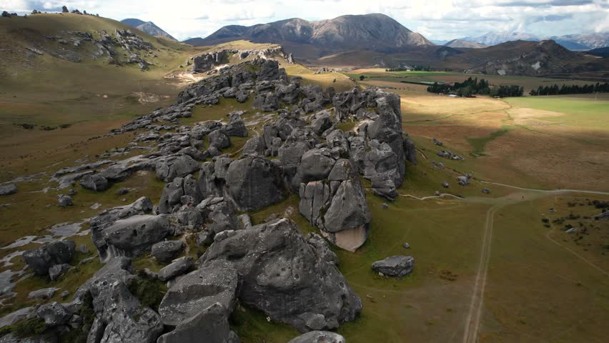 Castle Hill limestone formations and Canterbury mountain landscape aerial panoramic, New Zealand.
