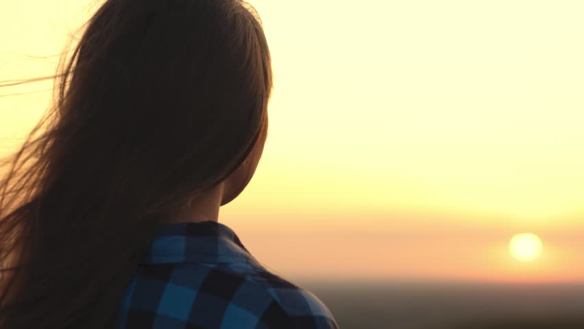 girl tousled hair wind. silhouette girl. man journey sunset. look into distance. female travel picnic. beautiful girl against backdrop heavenly sunset evening. free feeling life. woman hair wind. Royalty-Free Stock Footage #1101391677