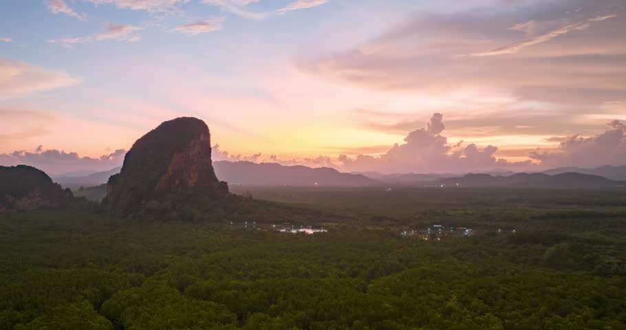 Aerial view of Phang Nga bay with mountains at morning sunrise in Krabi, Thailand. Landscape of Amazing red sky with dramatic sea at magic moment. Fantastic natural Drone time-lapse over the Bay. Royalty-Free Stock Footage #1101392601