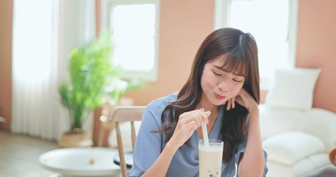 asian girl drink bubble tea - tradition taiwanese food serving you happy comfortable living room Arkistovideo