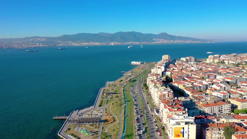 izmir karsiyaka district, sea and ferries and traffic n aerial view with drone on a sunny day Royalty-Free Stock Footage #1101400377
