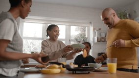 Family and boy with Down syndrome making pancakes for breakfast - Powered by Shutterstock - Get 15% off with code: PIKWIZARD15