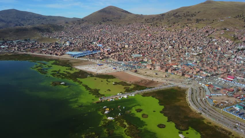 Aerial panorama of Puno with Lake Titicaca in Peru, South America