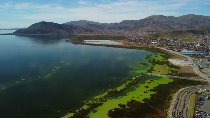 Aerial panorama of Puno with Lake Titicaca in Peru, South America