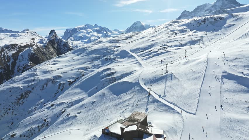 Aerial panorama view of the luxury hotel and the astronomic observatory at the Gornergrat, in the background of the Matterhorn or Cervino mount, Zermatt, Valais, Switzerland, Europe