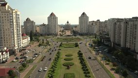 Obolon, Kyiv, 09052020. Sleeping area of ​​the city on a sunny autumn day. Residential buildings, church, embankment. Drone video 4K.