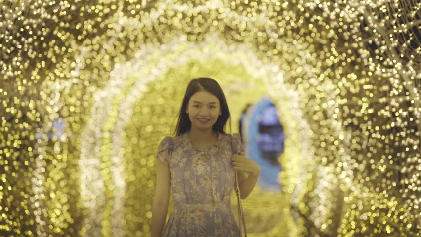 Portrait of happy Asian woman with bokeh blurry background for lighting festive celebration concept. illumination. People lifestyle.