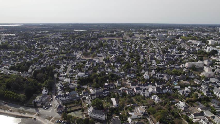 Town of Vannes Northern France with homes and residential apartment buildings, Aerial dolly left shot