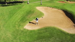 Golfer lofting ball out of bunker-Aerial shot-4K - Powered by Shutterstock - Get 15% off with code: PIKWIZARD15