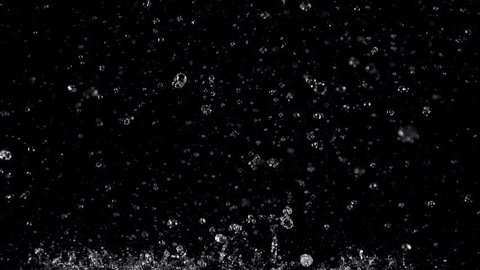 Super Slow Motion Shot of Real Rain Drops Falling Down Isolated on Black Background at 1000fps.: stockvideo