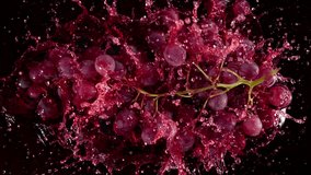 Super Slow Motion Shot of Fresh Grape Falling into Red Wine on Black Background at 1000 fps. - Powered by Shutterstock - Get 15% off with code: PIKWIZARD15