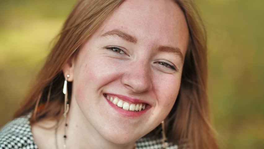 The face of a young 17-year-old girl. Close-up.