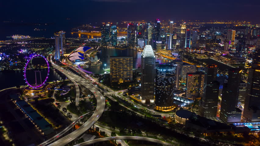 night illumination singapore city downtown traffic streets aerial timelapse panorama 4k