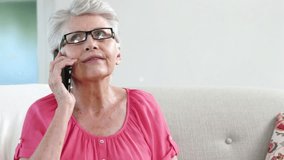 Animation of senior caucasian woman talking on smartphone over network of connections with icons. Global business and digital interface concept digitally generated video. - Powered by Shutterstock - Get 15% off with code: PIKWIZARD15