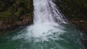 Aerial shots of a waterfall in the Dolomites. Waterfall Cascate di Riva. Drone video of the Riva River in Italy. 