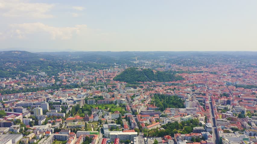 Inscription on video. Graz, Austria. The historic city center aerial view. Mount Schlossberg (Castle Hill). Knitted texture inscription, Aerial View, Point of interest