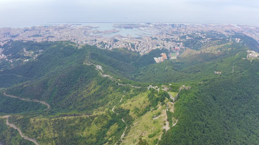 Inscription on video. Genoa, Italy. Forte Sperone is a key point of the 19th-century Genoese fortifications and is located on top of the Mura Nuove. View of Genoa. On the mechanical display, Aerial V