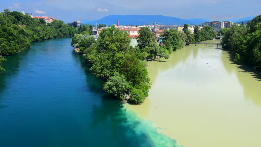 Famous La Jonction, the joint and confluence of rivers Rhone on the left and Arve on the right in Geneva, Switzerland.