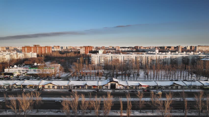 Aerial view. Winter panorama of the city of Tolyatti in the Samara region. Snow-covered streets of a provincial and industrial Russian city. Royalty-Free Stock Footage #1101444453