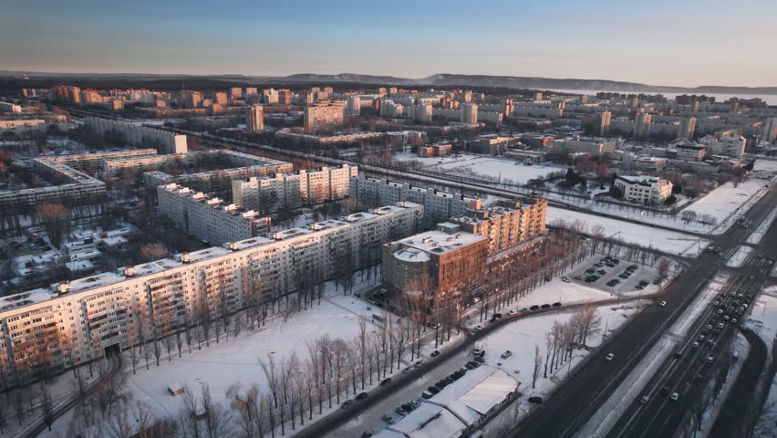 Aerial view. Winter panorama of the city of Tolyatti in the Samara region. Snow-covered streets of a provincial and industrial Russian city. Royalty-Free Stock Footage #1101444459