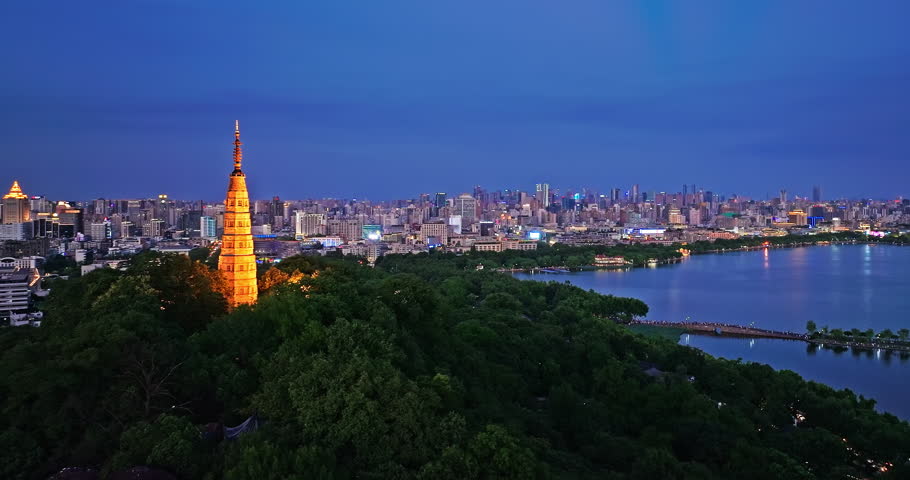 Aerial view of Hangzhou skyline and ancient Baochu Tower at night, China.