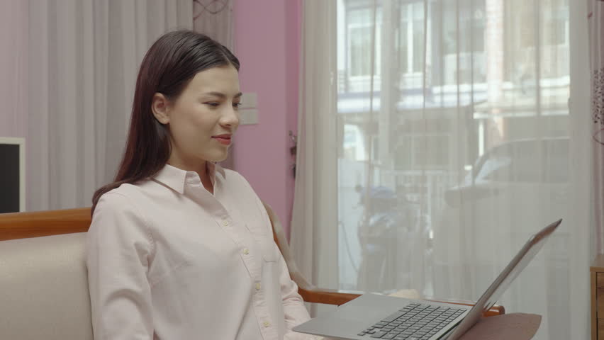 Beautiful mute woman using sign language to communicate via video call on laptop, wireless technology, 5G.