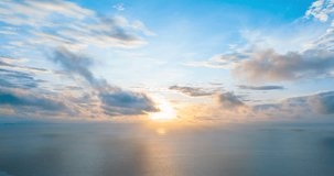 4K Time lapse of colorful sunrise or sunset landscape background. Amazing light of nature blue sky pastel pink moving cloud and golden yellow cloudscape timelapse in tropical summer spring sunlight.