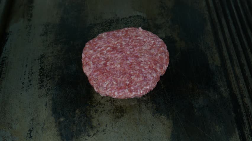 Grilling Beef Meat For Hamburger. Street Food. Fast Food