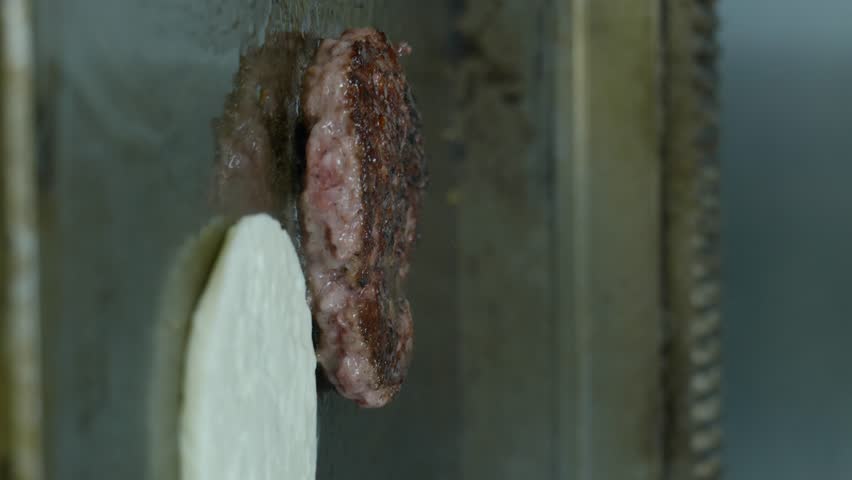Vertical Shot Of Grilled Burger Meat And Halloumi On A Hot Frying Pan. Street Food