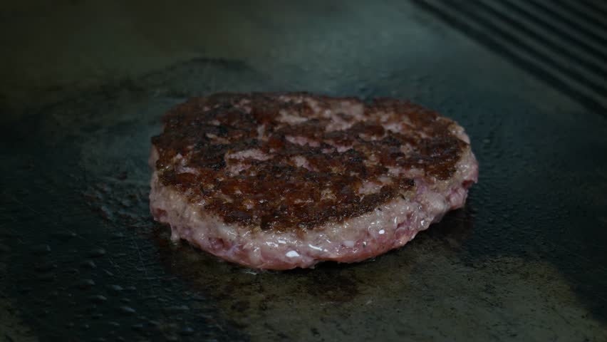 Burger Meat Fried On An Electric Stove Grill. Street Food