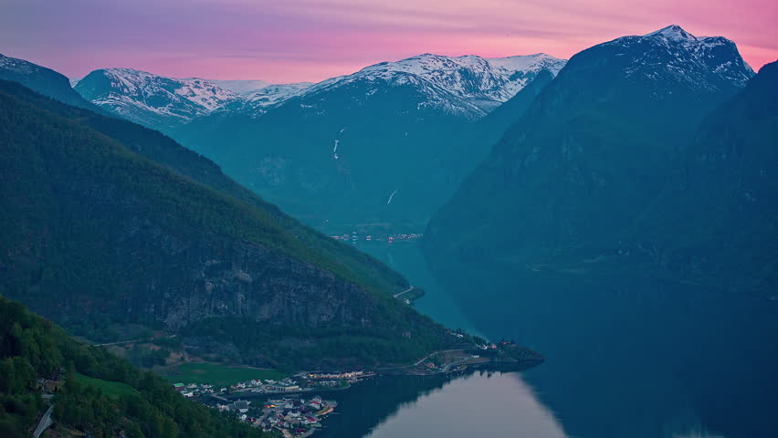 Purple sky above majestic fjord of Norway, fusion time lapse