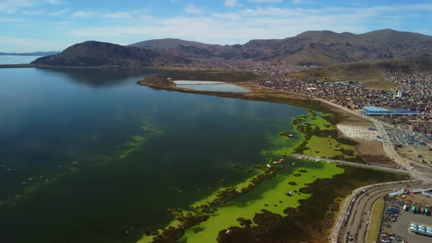 Aerial panorama of Puno with Lake Titicaca in Peru, South America