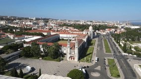 A camera drone flies forward above the Jerónimos Monastery and Maritime Museum, Lisbon, Portugal
