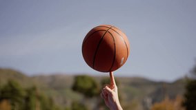 Trick with a spinning basketball ball on finger attempt in slow motion. Sport lifestyle. Sport for everyone - Powered by Shutterstock - Get 15% off with code: PIKWIZARD15