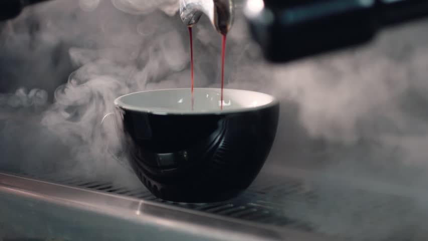 Coffee machine filling a cup with. Making coffee by coffee machine into cup, espresso coffee coming out from an automated coffemaker machine. | Shutterstock HD Video #1101473885