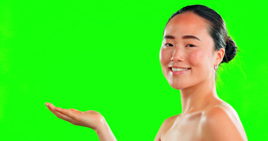 Beauty, hands and asian woman with space on green screen for skincare, cosmetic or dermatology. Portrait of female hand palm for product placement for self care, natural facial glow and studio mockup