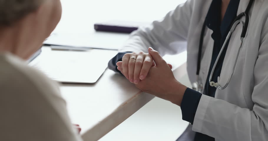 Geriatric doctor talking to elderly patient woman with gestures over work table. Close up of hands. Senior older lady consulting practitioner, listening medical treatment advice Royalty-Free Stock Footage #1101476229