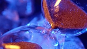 Time running out in a blue hourglass - Powered by Shutterstock - Get 15% off with code: PIKWIZARD15