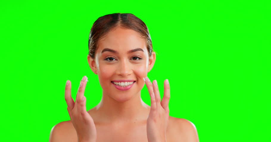 Face, skincare and woman with cream, cosmetics and dermatology against a studio background. Portrait, female and lady with lotion, creme and morning routine for grooming, treatment and green screen | Shutterstock HD Video #1101484173