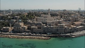 Tel Aviv - Jaffa, view from above. Modern city and the old city. Bird's-eye view. Israel, the Middle East. Aerial photography. Sea, skyline and blue cloudless sky. Drone video, quadcopter video.