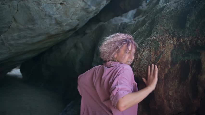 This young woman in a pink dress performs her dance.