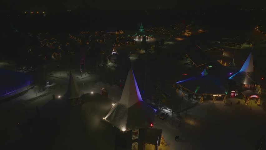 Santa Claus Village Shooting at Santa Claus near Rovaniemi in Lapland - Finland. Ice hotel with ice bar and restaurant services. carved ice walls. drone videos. Night at Santa Claus. Lights and snow. 