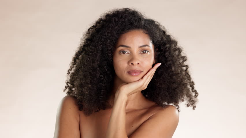 Beauty, skincare and blowing kiss with woman in studio for cosmetics, satisfaction and self love. Happy, confident and glow with model for clean, dermatology and spa on brown background | Shutterstock HD Video #1101488499