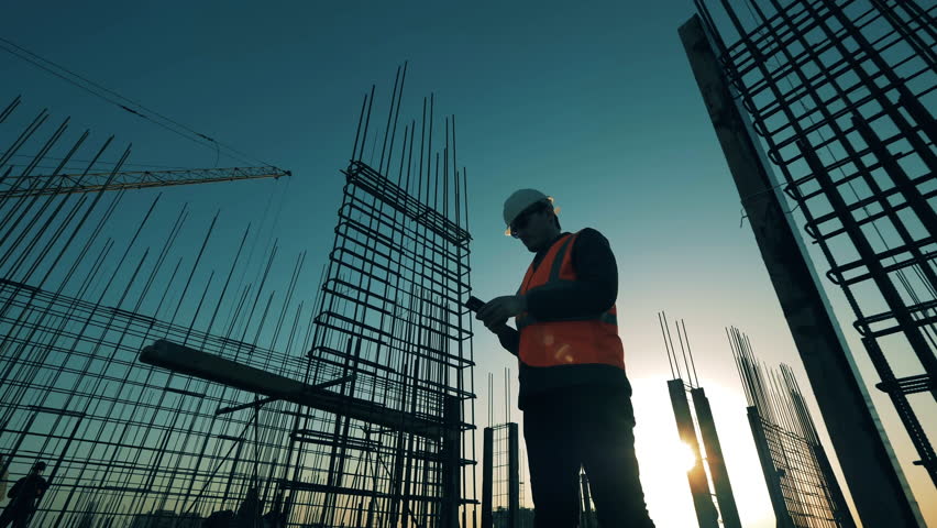 Constructor is making calculations at the rooftop building lot