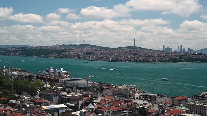 View from the roof of the Bosphorus Strait with ships and a mosque. Summer panoramic landscape in Istanbul, Turkey. 