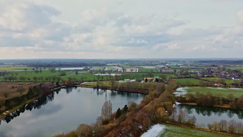 View from above on fields and small lakes in the north of Germany.