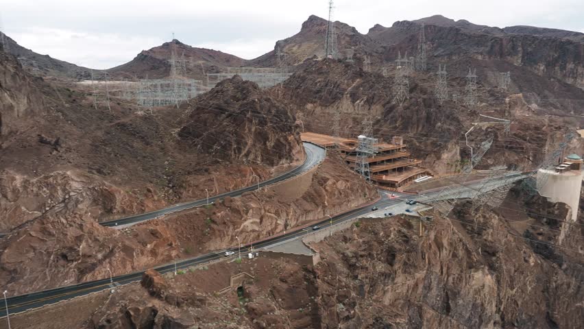 Dark, rainy, and cloudy day at the Hoover Dam in Arizona and Nevada. Angle from above overlooking this marvel of engineering of the Black Canyon