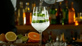 Super Slow Motion Shot of Pouring Gin and Tonic Into Long Glass with Camera Motion at 1000fps. - Powered by Shutterstock - Get 15% off with code: PIKWIZARD15