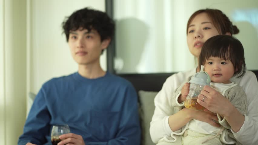 Family watching sports on TV
